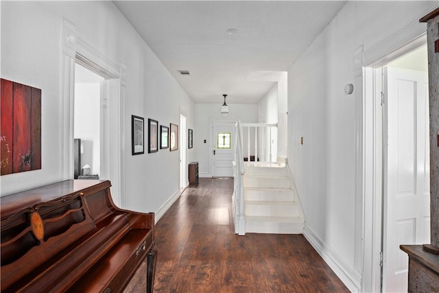 hallway featuring dark hardwood / wood-style flooring