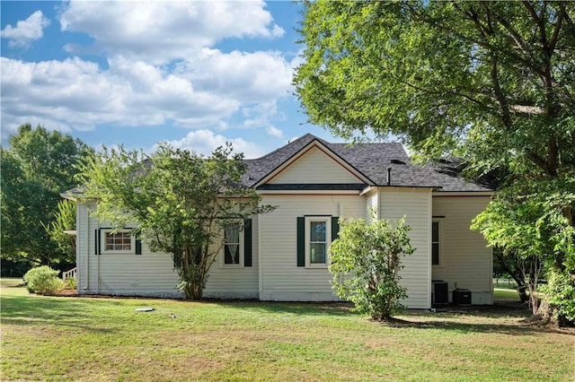 rear view of house with a lawn