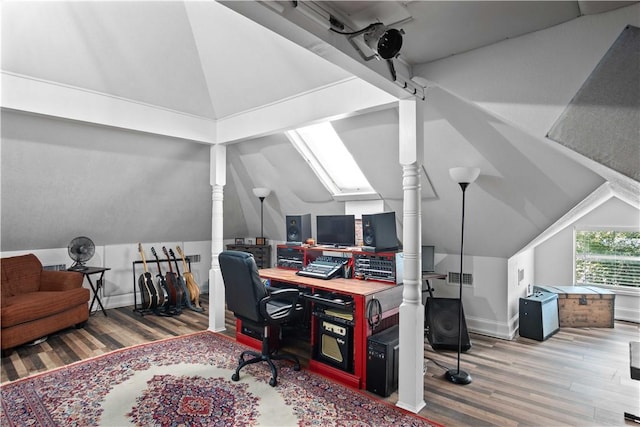 office featuring lofted ceiling and wood-type flooring