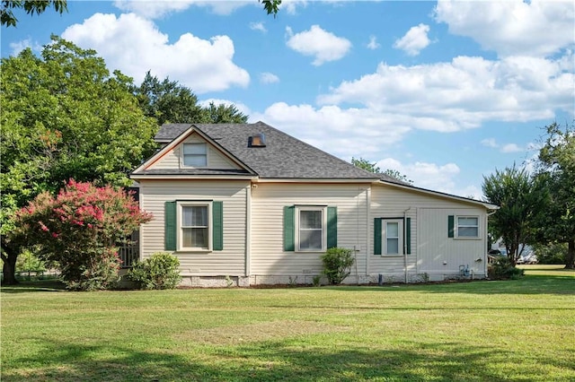 view of side of home featuring a lawn