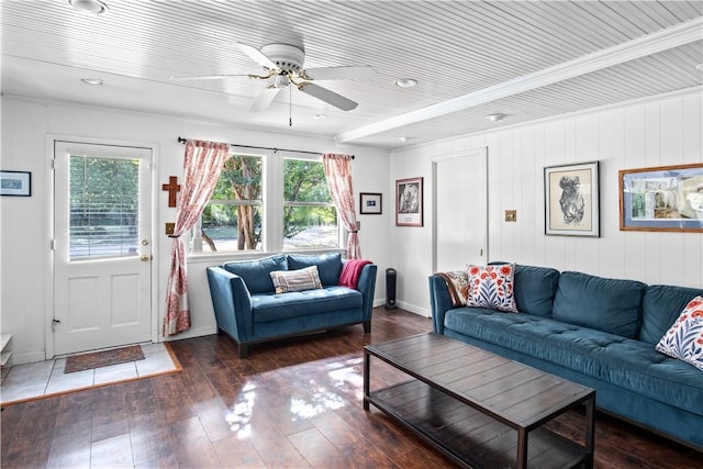 living room with ceiling fan and dark wood-type flooring