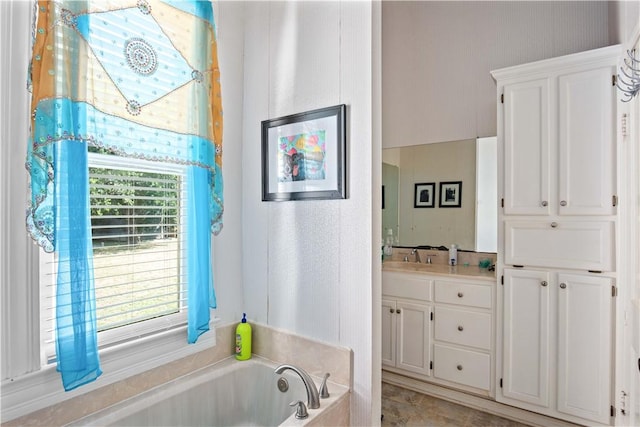 bathroom featuring a bathing tub and vanity