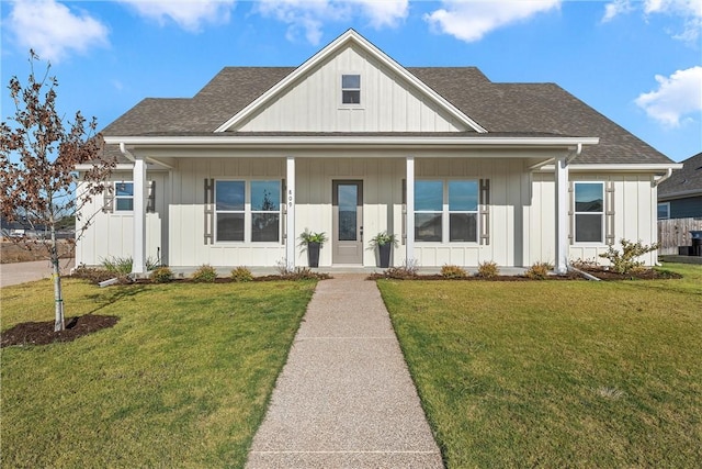 view of front of property with covered porch and a front yard