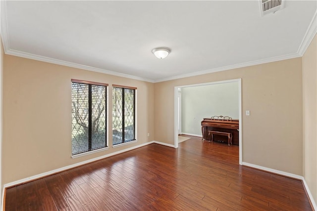 unfurnished room with crown molding and dark wood-type flooring