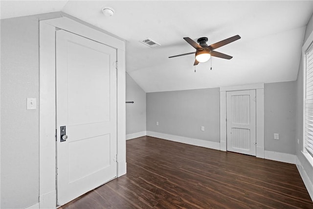 additional living space featuring ceiling fan, lofted ceiling, and dark wood-type flooring