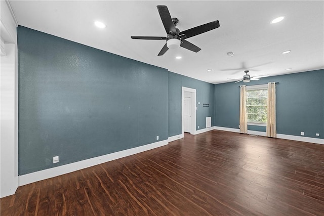 spare room featuring hardwood / wood-style flooring and ceiling fan