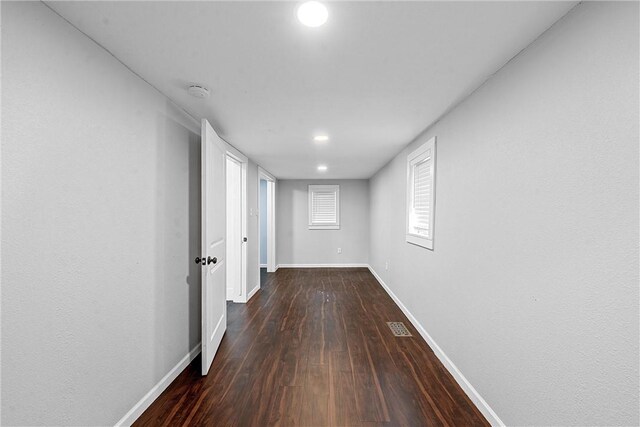 corridor featuring dark hardwood / wood-style floors