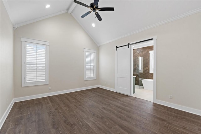 unfurnished bedroom with ensuite bathroom, high vaulted ceiling, dark hardwood / wood-style flooring, a barn door, and beam ceiling