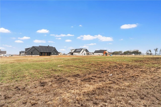 view of yard with a rural view