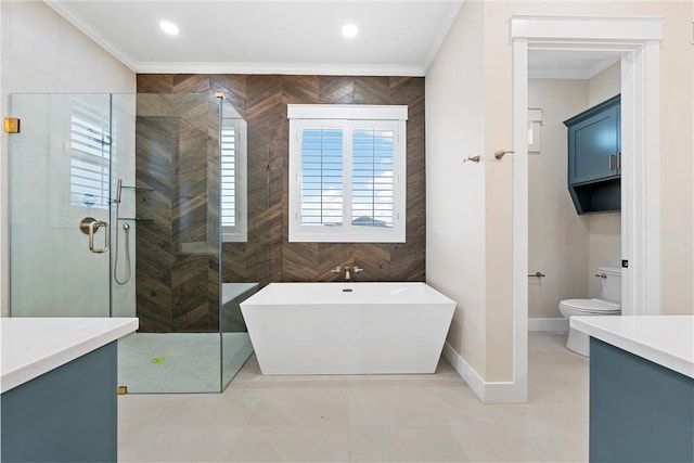 full bathroom featuring vanity, crown molding, and toilet