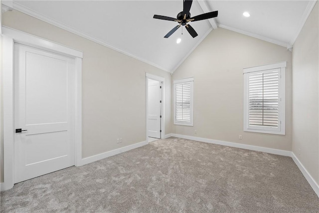 unfurnished bedroom with light carpet, ornamental molding, lofted ceiling with beams, and ceiling fan