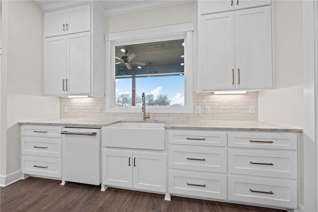 kitchen with sink, dark wood-type flooring, ceiling fan, white cabinetry, and light stone countertops