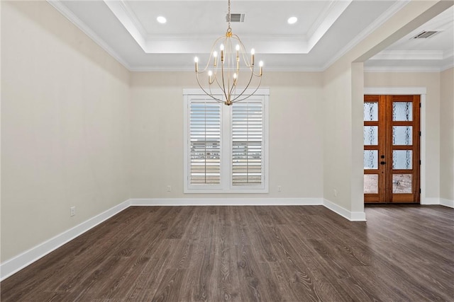 unfurnished dining area featuring ornamental molding, a tray ceiling, dark hardwood / wood-style flooring, and a notable chandelier