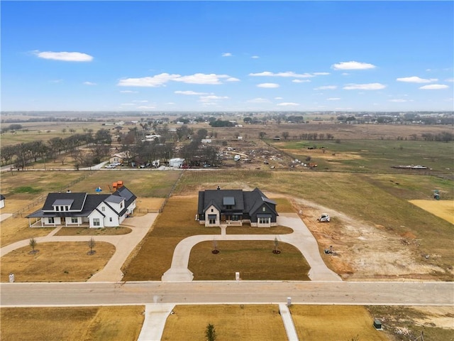 birds eye view of property featuring a rural view