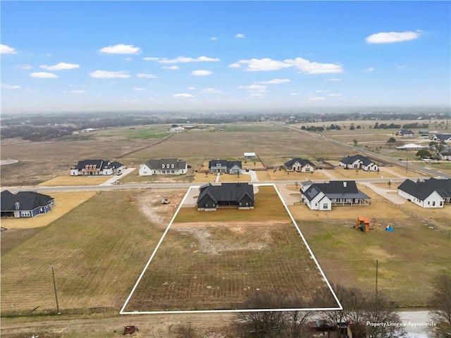 birds eye view of property featuring a rural view