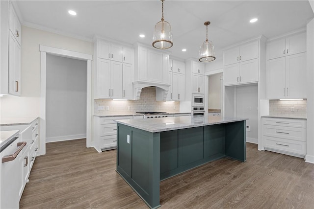 kitchen featuring a kitchen island, decorative light fixtures, white cabinetry, dark hardwood / wood-style flooring, and light stone countertops