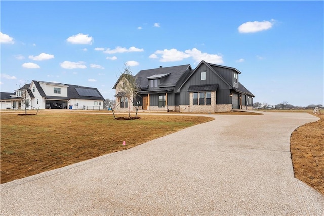 modern farmhouse with a front yard