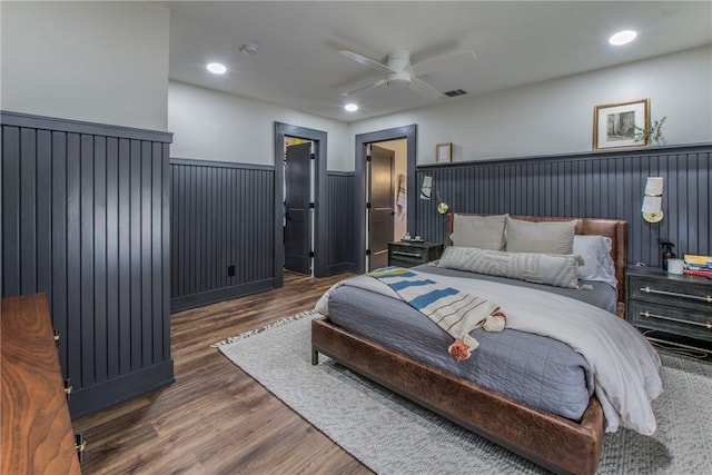 bedroom featuring a wainscoted wall, recessed lighting, visible vents, and wood finished floors