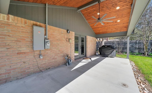 view of patio with grilling area, ceiling fan, french doors, and fence