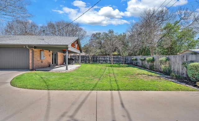 view of yard with a patio and a fenced backyard