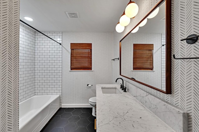 full bath featuring tile patterned floors, visible vents, wallpapered walls, and toilet