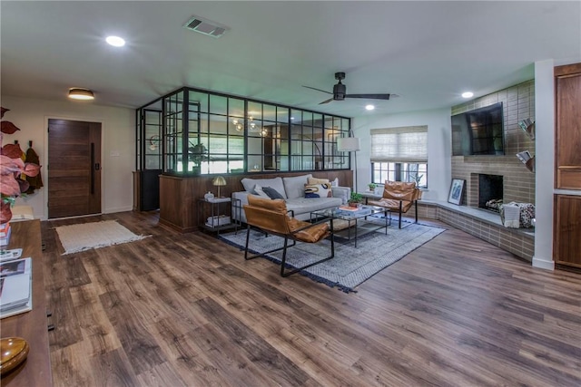 living area featuring recessed lighting, visible vents, ceiling fan, and dark wood-style flooring