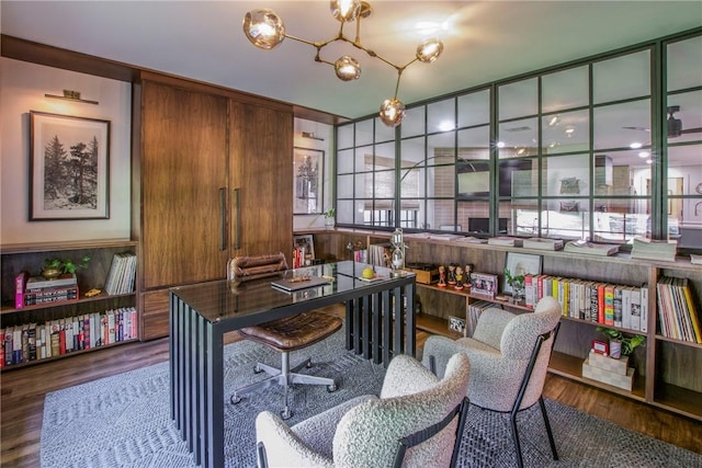 office with an inviting chandelier and wood finished floors