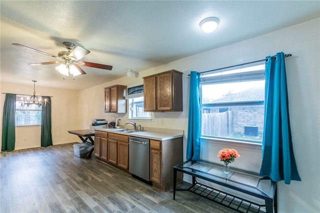 kitchen with decorative light fixtures, stainless steel dishwasher, a healthy amount of sunlight, and sink