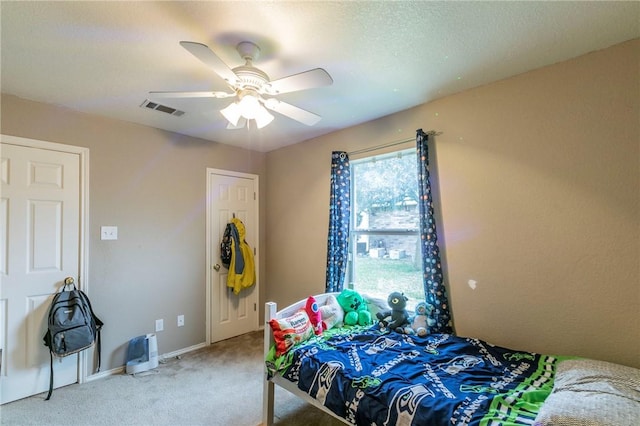 carpeted bedroom featuring ceiling fan