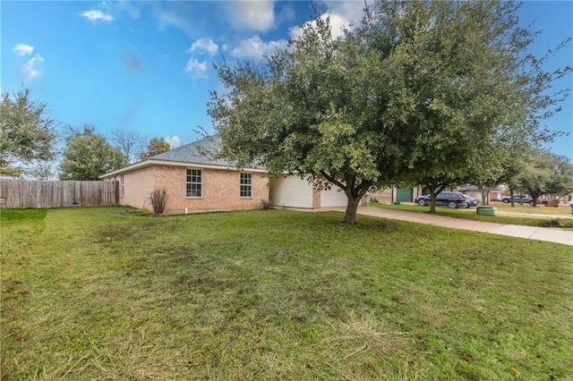 view of yard featuring a garage