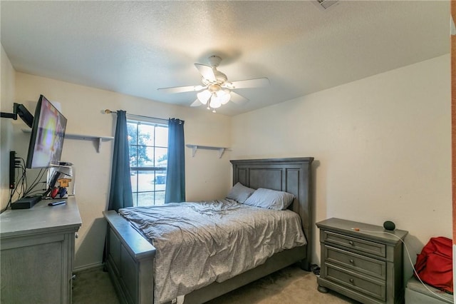 bedroom featuring light carpet and ceiling fan