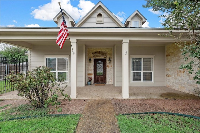 property entrance with covered porch