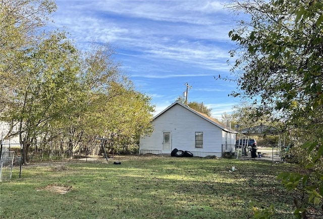 view of home's exterior featuring a yard