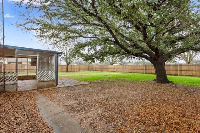 view of yard featuring a sunroom