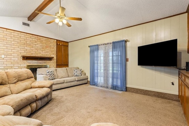 living room with ceiling fan, vaulted ceiling with beams, light colored carpet, and a textured ceiling