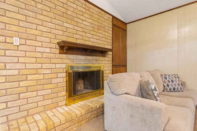 living room featuring a brick fireplace, crown molding, vaulted ceiling, and a textured ceiling