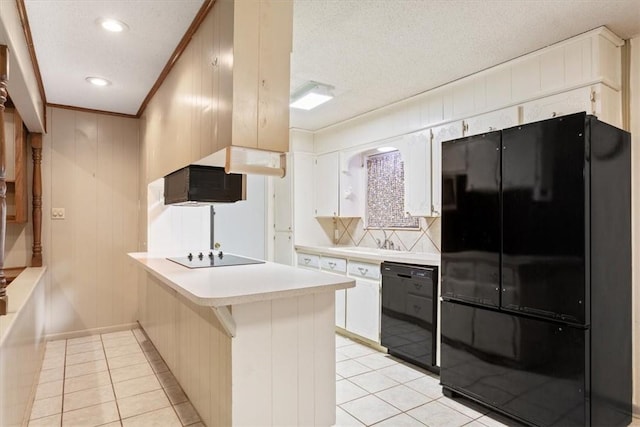 kitchen with white cabinetry, light tile patterned flooring, kitchen peninsula, and black appliances