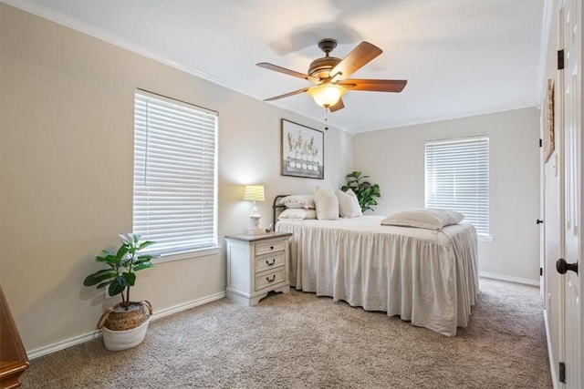 carpeted bedroom featuring ceiling fan, crown molding, and multiple windows