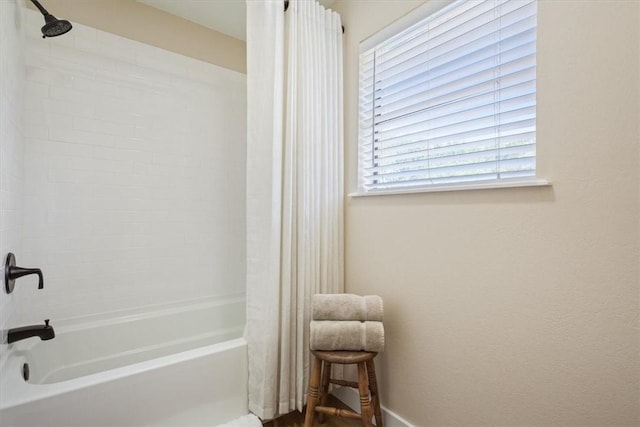 bathroom with shower / tub combo