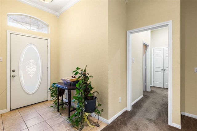 foyer featuring ornamental molding and light carpet