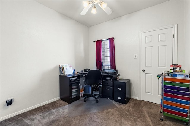 office with ceiling fan and dark carpet