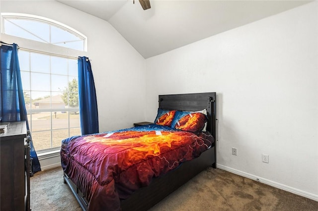 bedroom with ceiling fan, carpet floors, and lofted ceiling