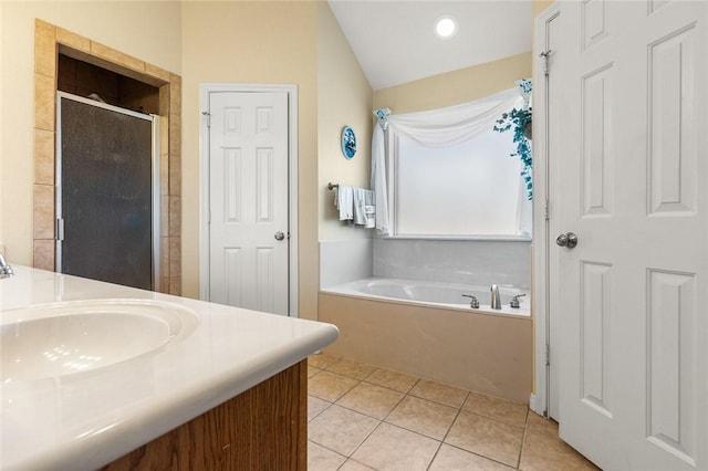 bathroom with tile patterned flooring, vanity, and independent shower and bath