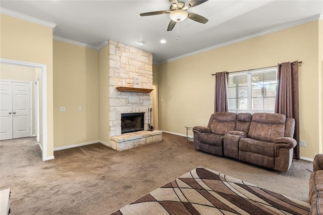 living room featuring carpet flooring, a stone fireplace, ceiling fan, and crown molding