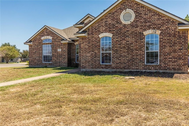 view of property with a front lawn