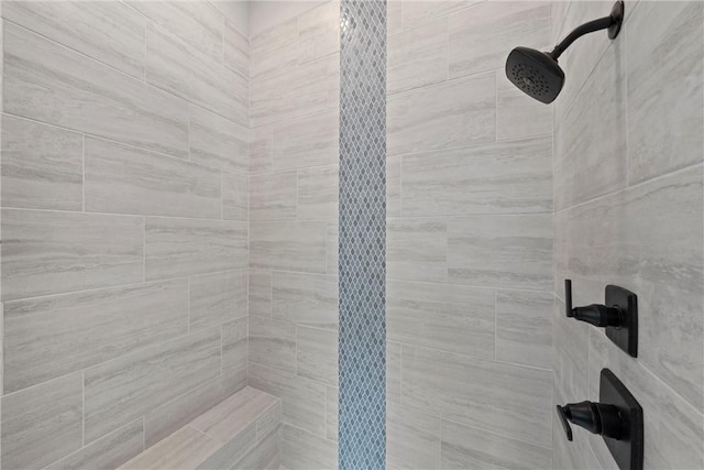 bathroom featuring tiled shower