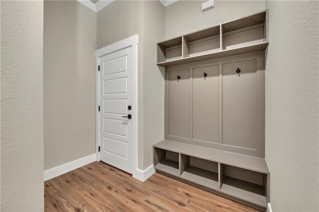 mudroom with light hardwood / wood-style floors