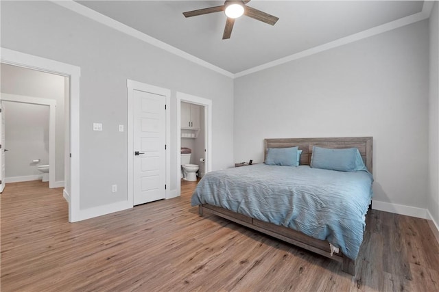 bedroom with ensuite bath, ceiling fan, crown molding, and hardwood / wood-style flooring