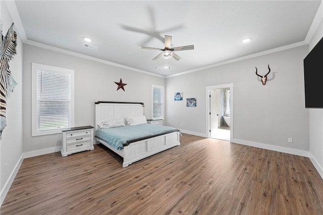 bedroom featuring wood-type flooring, connected bathroom, ceiling fan, and crown molding