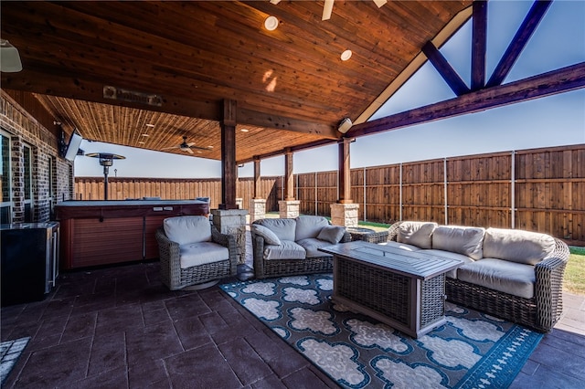 view of patio with an outdoor hangout area and a hot tub